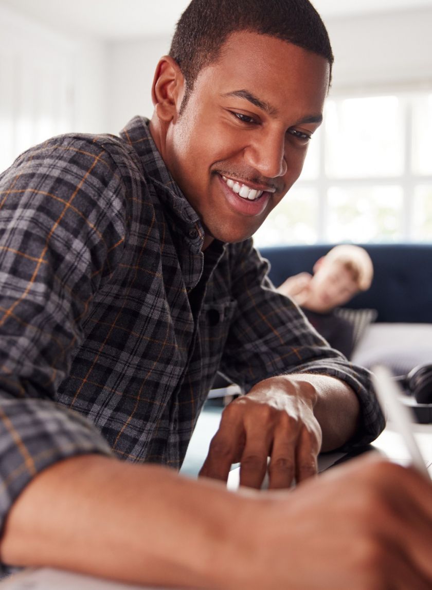 Two Male College Students In Shared House Bedroom Studying Together